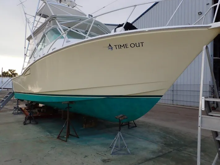 Time Out Yacht Photos Pics 2000 Cabo 35 Express boat named "Time Out" on dry dock.