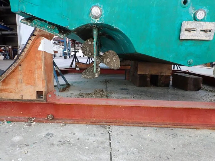 Time Out Yacht Photos Pics Cabo 35 Express 2000 boat hull and propeller in dry dock for maintenance.