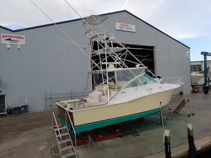 Time Out Yacht Photos Pics 2000 Cabo 35 Express boat on dry dock at MarineMax Venice.