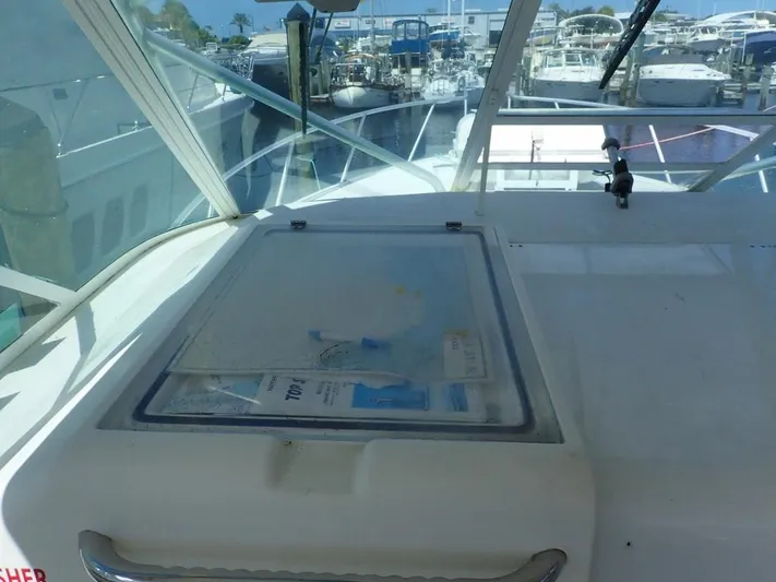 Time Out Yacht Photos Pics Cabo 35 Express 2000 model boat interior with marina view in background.