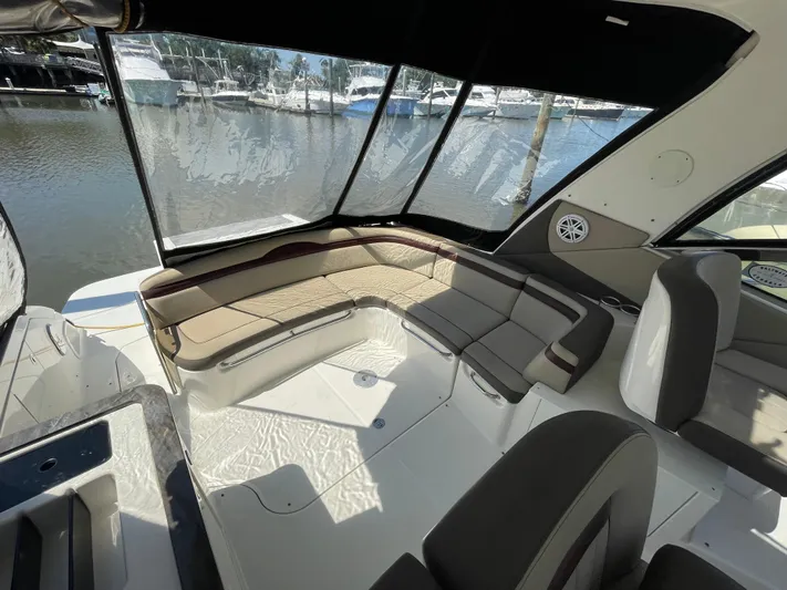  Yacht Photos Pics Interior seating area of 2014 Sea Ray 370 Sundancer yacht with marina view.