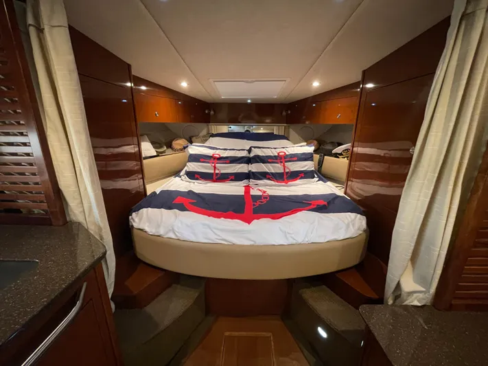  Yacht Photos Pics Luxurious cabin interior of a 2014 Sea Ray 370 Sundancer yacht with anchor-themed bedding.