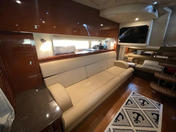  Yacht Photos Pics Interior of 2014 Sea Ray 370 Sundancer with beige leather sofa and modern amenities.