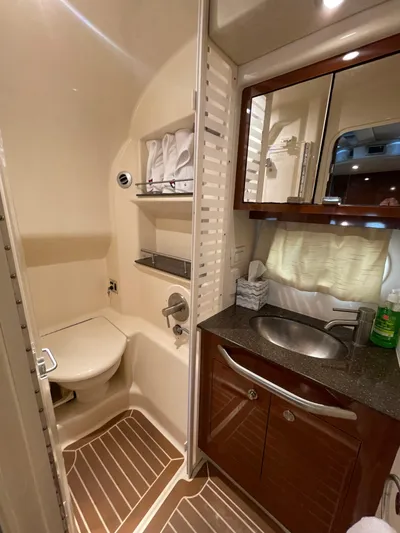  Yacht Photos Pics 2014 Sea Ray 370 Sundancer bathroom with sink, mirror, and toilet.
