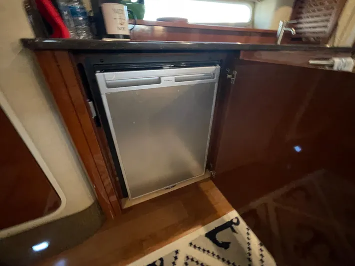  Yacht Photos Pics Built-in refrigerator in the galley of a 2014 Sea Ray 370 Sundancer yacht.