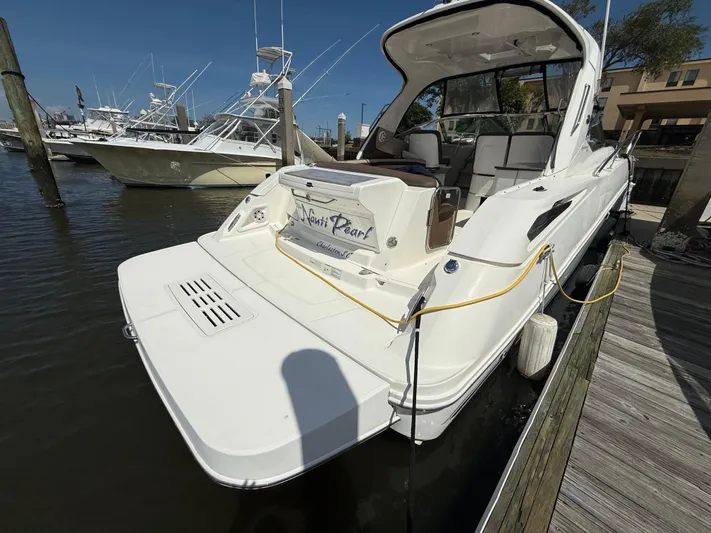  Yacht Photos Pics 2014 Sea Ray 370 Sundancer docked at marina, rear view.