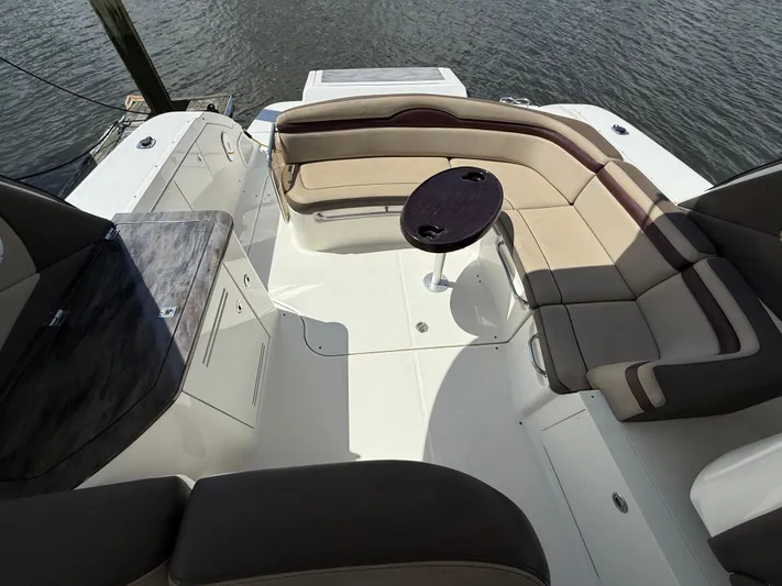  Yacht Photos Pics 2014 Sea Ray 370 Sundancer boat with spacious seating and table on deck.