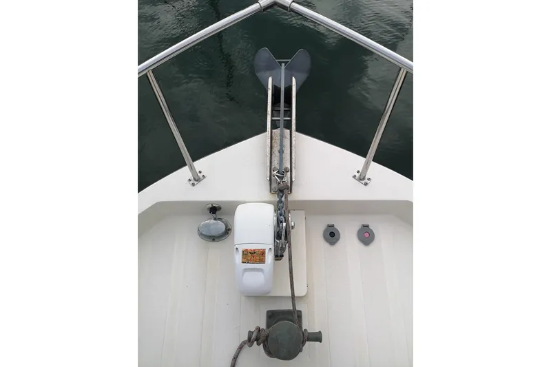  Yacht Photos Pics Bow view of 1990 Nordic Tug 32 with anchor and railing.