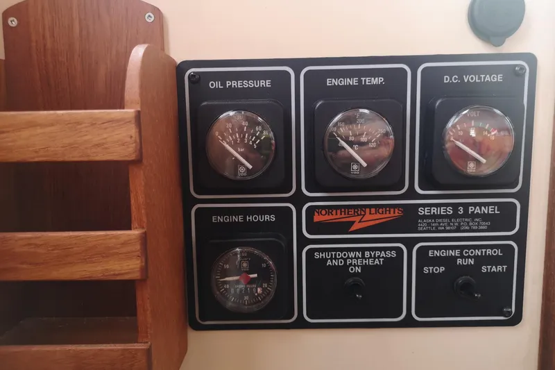  Yacht Photos Pics Control panel of a 1990 Nordic Tug 32, featuring gauges and switches.