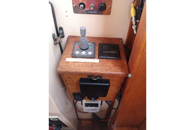  Yacht Photos Pics Control panel of a 1990 Nordic Tug 32 boat with switches and joystick.