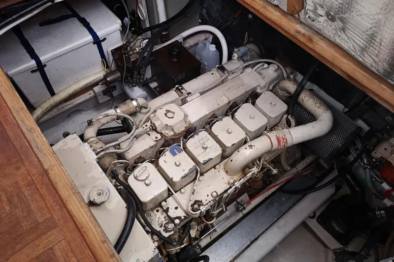  Yacht Photos Pics Engine compartment of a 1990 Nordic Tug 32, showcasing detailed mechanical components.