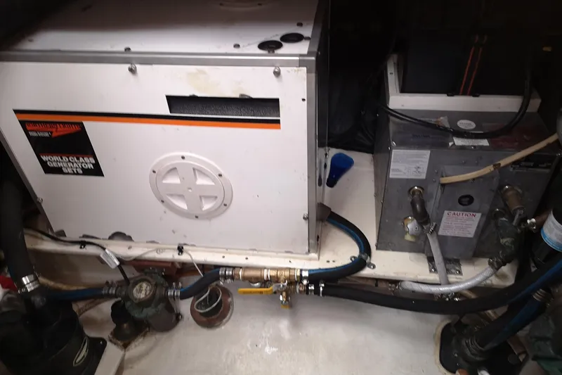  Yacht Photos Pics Engine room of a 1990 Nordic Tug 32 with generator and equipment.