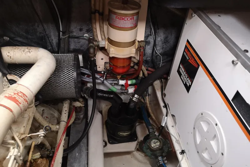  Yacht Photos Pics Engine room of 1990 Nordic Tug 32 with Racor fuel filter and generator.