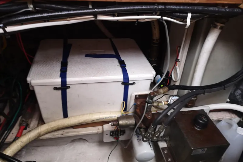  Yacht Photos Pics Engine compartment of a 1990 Nordic Tug 32 with various mechanical components.