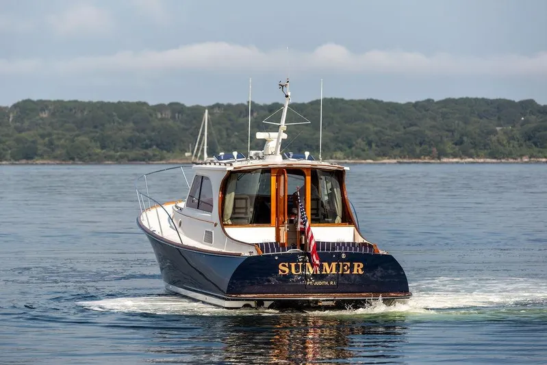 Summer Yacht Photos Pics 2002 Hinckley Talaria 44 yacht named "Summer" cruising on calm waters.