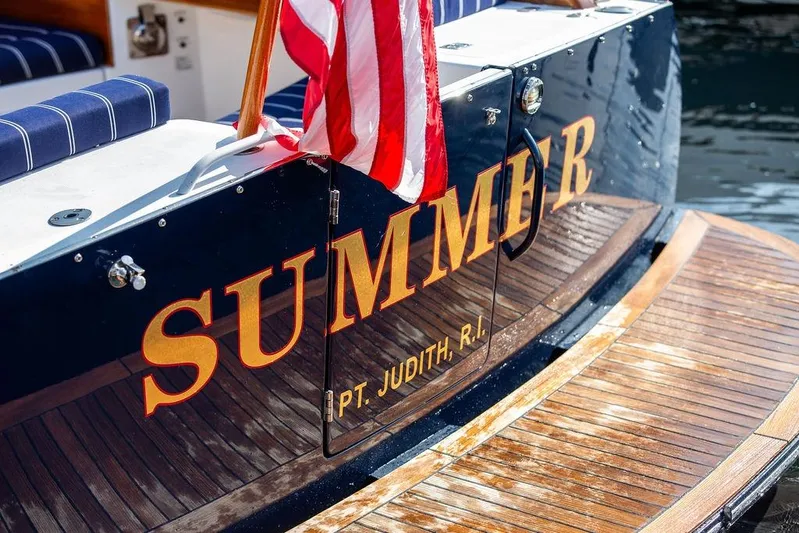 Summer Yacht Photos Pics Hinckley Talaria 44 yacht, 2002, with American flag and "SUMMER" name, docked at Pt. Judith, R.I.