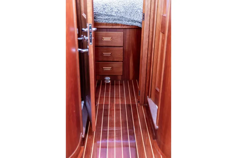 Summer Yacht Photos Pics Interior of 2002 Hinckley Talaria 44 yacht with wooden flooring and cabinetry.