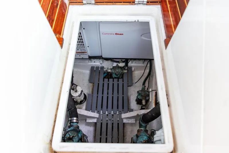 Summer Yacht Photos Pics Engine compartment of 2002 Hinckley Talaria 44 with Cummins Onan generator visible.