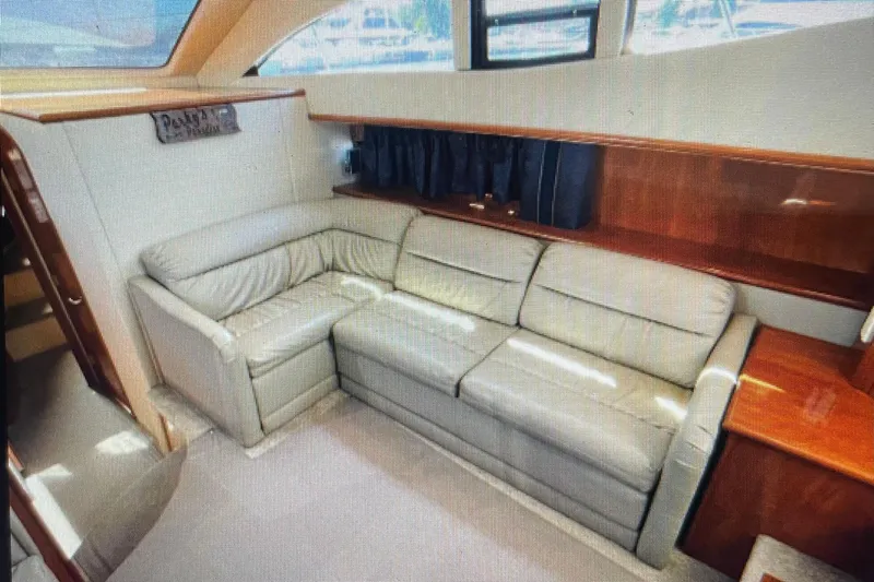 It's Flight O'clock Somewhere Yacht Photos Pics Luxurious interior of 2006 Cruisers Yachts 385 Motoryacht with leather seating and wood accents.