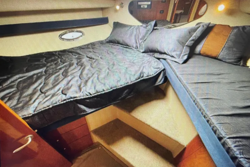 It's Flight O'clock Somewhere Yacht Photos Pics Luxurious cabin interior of 2006 Cruisers Yachts 385 Motoryacht with cozy bedding.