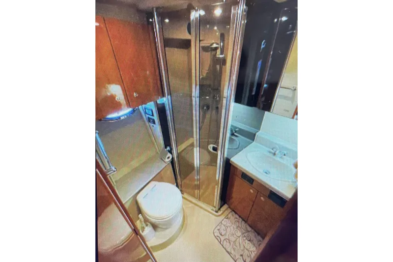 It's Flight O'clock Somewhere Yacht Photos Pics Luxurious bathroom in 2006 Cruisers Yachts 385 Motoryacht with shower and vanity.