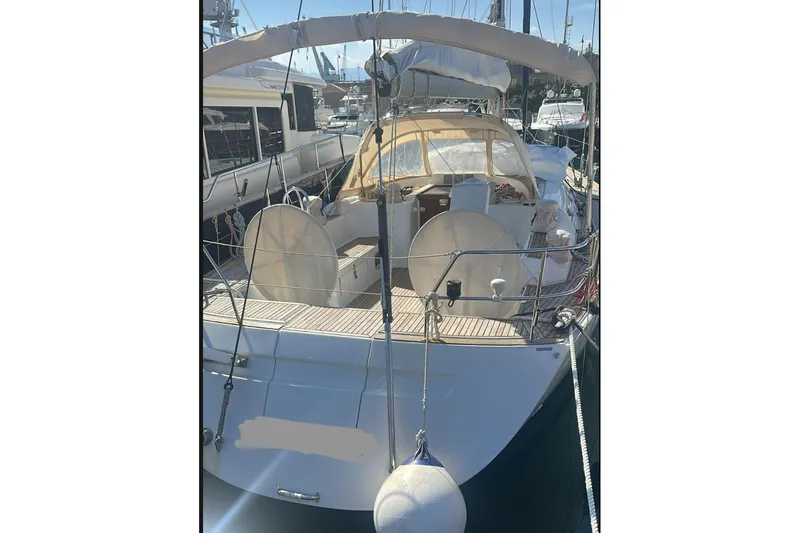  Yacht Photos Pics Grand Soleil 50 yacht, 2009 model, docked at marina with covered cockpit.