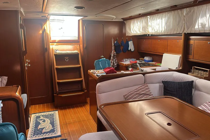  Yacht Photos Pics Interior of 2009 Grand Soleil 50 yacht with cozy seating and wooden finishes.