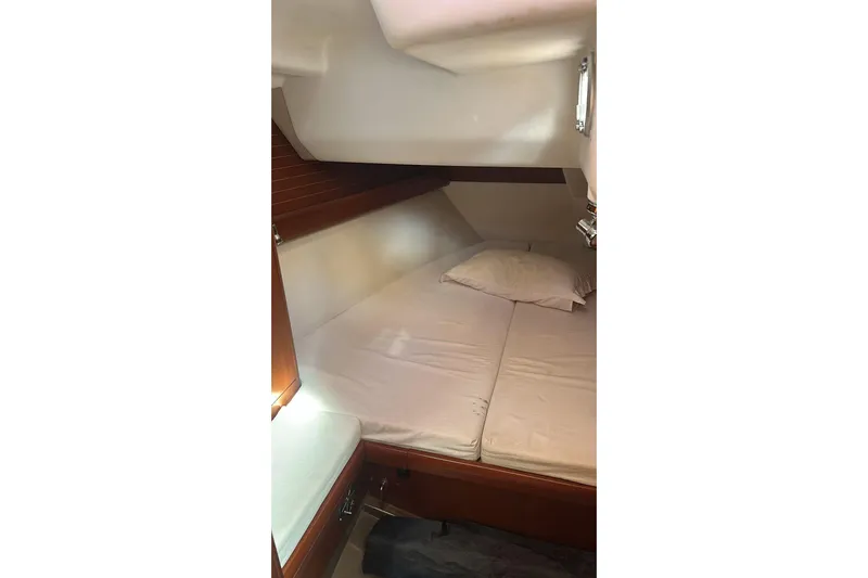  Yacht Photos Pics Cozy cabin interior of 2009 Grand Soleil 50 yacht with comfortable bedding.