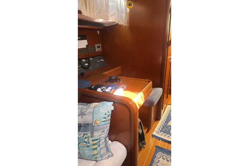  Yacht Photos Pics Interior of 2009 Grand Soleil 50 yacht with navigation station and nautical decor.