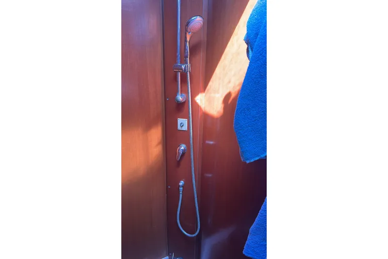  Yacht Photos Pics Shower area in 2009 Grand Soleil 50 yacht with wooden paneling and blue towel.