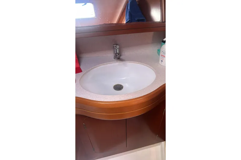  Yacht Photos Pics Bathroom sink in 2009 Grand Soleil 50 yacht with wooden cabinetry.