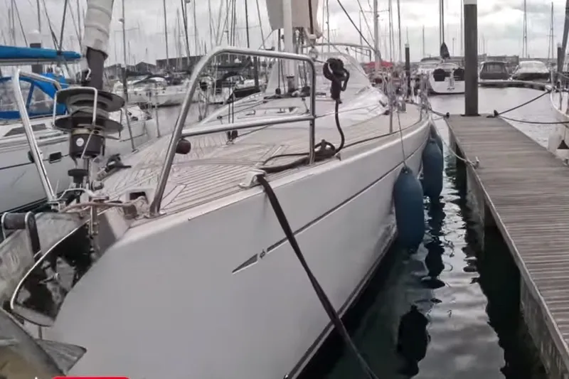  Yacht Photos Pics 2009 Grand Soleil 50 yacht docked at marina with fenders and rigging visible.