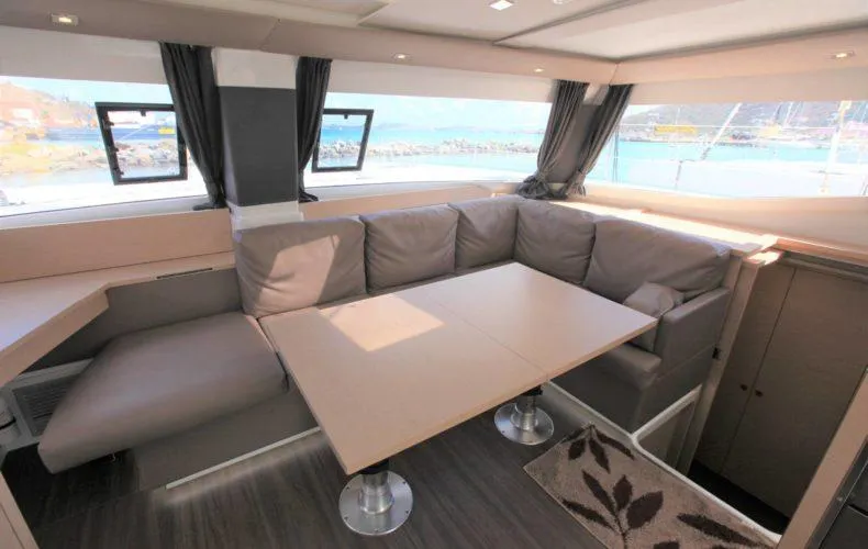 Anila Yacht Photos Pics 2018 Fountaine Pajot Helia 44 Evolution interior with modern seating and panoramic windows.