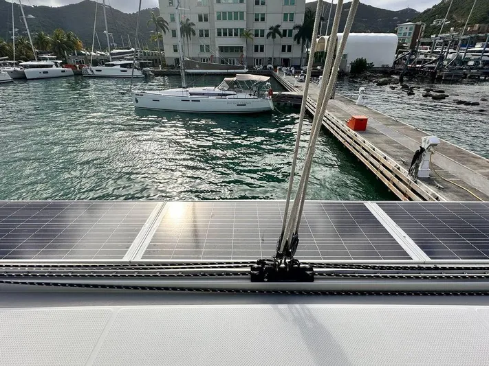 Anila Yacht Photos Pics Solar panels on 2018 Fountaine Pajot Helia 44 Evolution catamaran docked at marina.