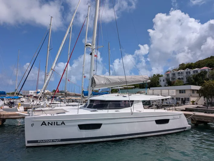 Anila Yacht Photos Pics 2018 Fountaine Pajot Helia 44 Evolution catamaran docked at marina under blue sky.