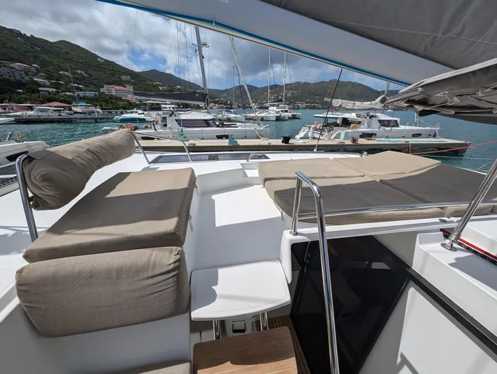 Anila Yacht Photos Pics Luxurious 2018 Fountaine Pajot Helia 44 Evolution catamaran with spacious deck and scenic marina view.