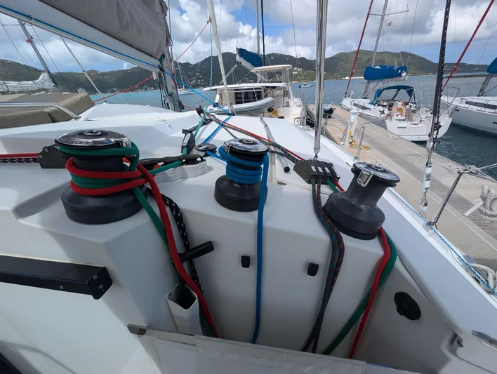 Anila Yacht Photos Pics Deck view of 2018 Fountaine Pajot Helia 44 Evolution catamaran with colorful ropes and winches.