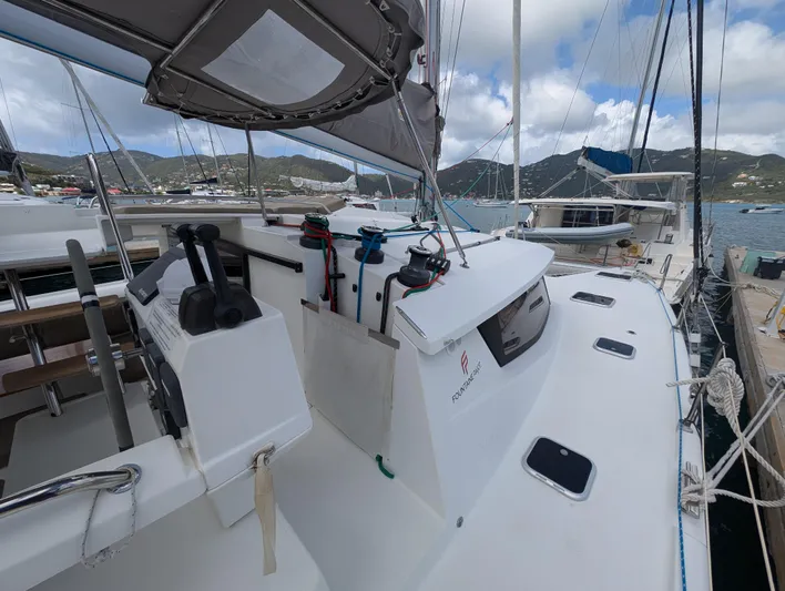 Anila Yacht Photos Pics 2018 Fountaine Pajot Helia 44 Evolution catamaran docked in a scenic marina.