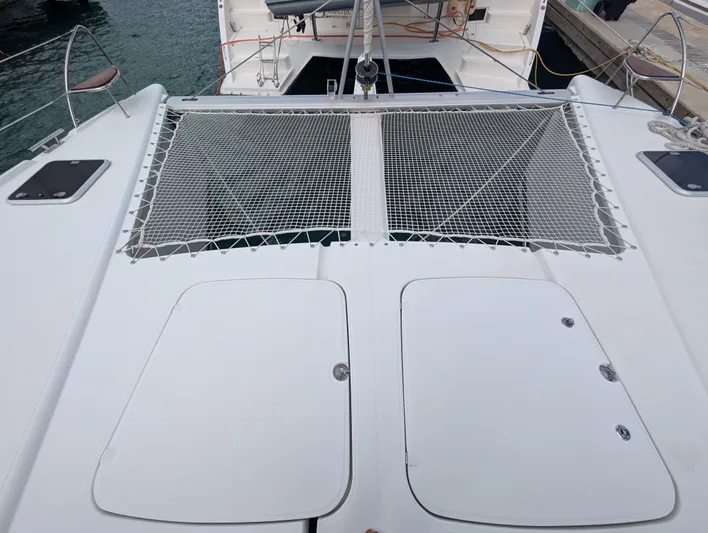 Anila Yacht Photos Pics 2018 Fountaine Pajot Helia 44 Evolution catamaran deck with netting and hatches.