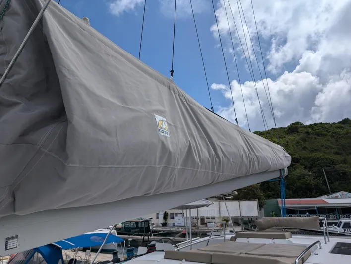 Anila Yacht Photos Pics Sail cover on 2018 Fountaine Pajot Helia 44 Evolution catamaran under blue sky.