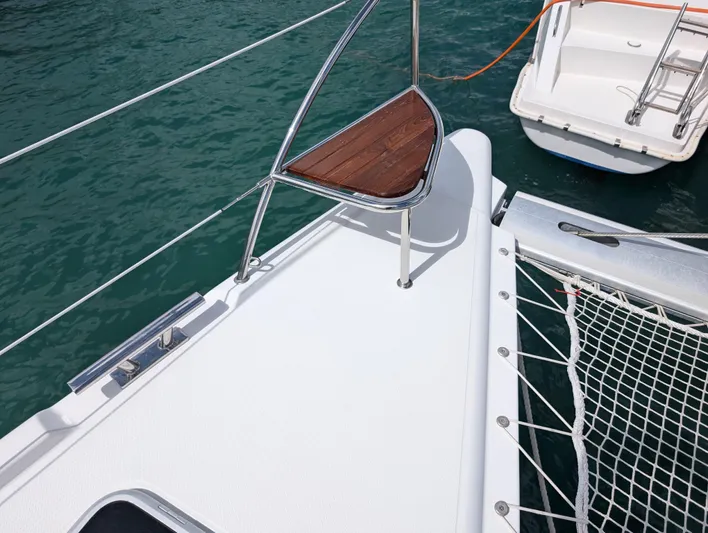 Anila Yacht Photos Pics 2018 Fountaine Pajot Helia 44 Evolution catamaran deck with netting and wooden seat.