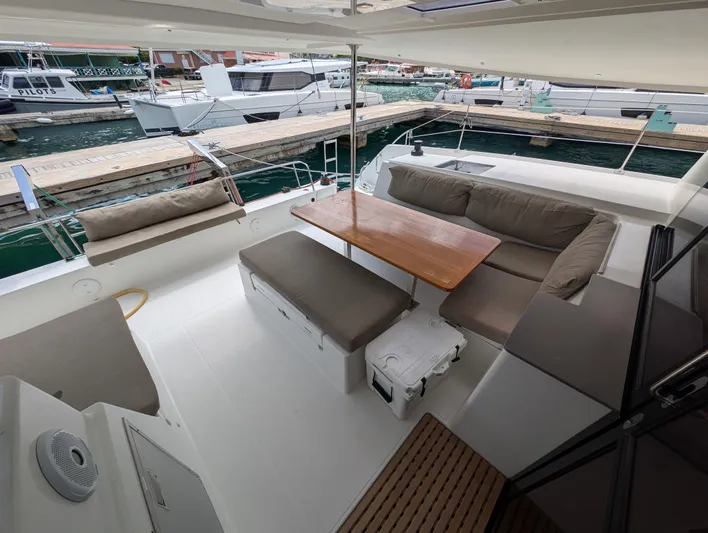 Anila Yacht Photos Pics 2018 Fountaine Pajot Helia 44 Evolution catamaran with spacious outdoor seating and dining area.