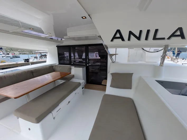 Anila Yacht Photos Pics Interior of 2018 Fountaine Pajot Helia 44 Evolution catamaran with seating and table.