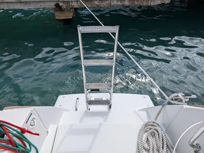 Anila Yacht Photos Pics Boarding ladder on 2018 Fountaine Pajot Helia 44 Evolution catamaran, docked by the water.