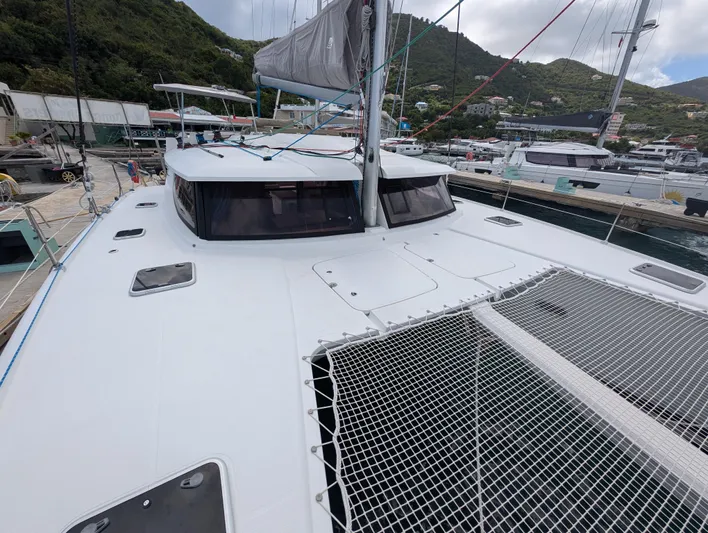 Anila Yacht Photos Pics 2018 Fountaine Pajot Helia 44 Evolution catamaran docked, showcasing sleek design and spacious deck.
