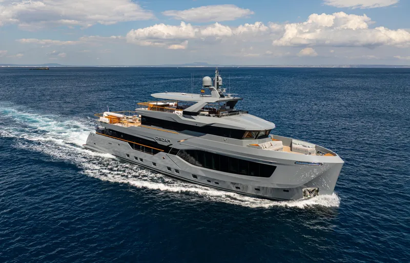 Oscar Yacht Photos Pics Luxury 2023 Numarine 37XP yacht cruising on open sea under clear skies.