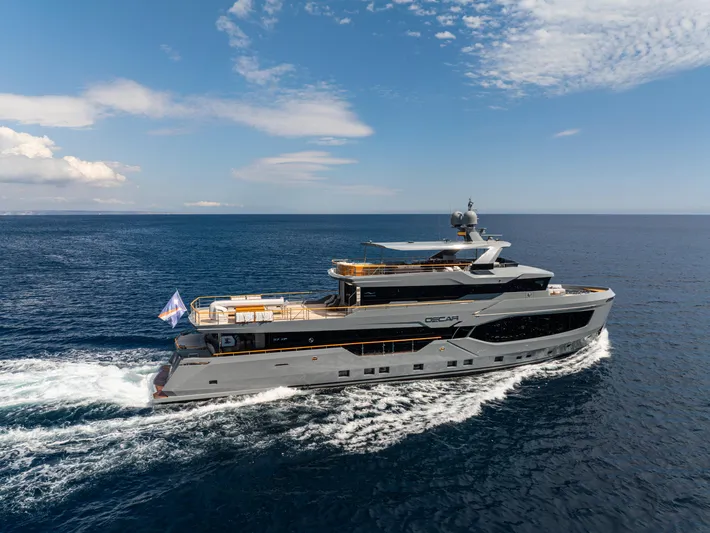 Oscar Yacht Photos Pics 2023 Numarine 37XP yacht cruising on open sea under clear skies.