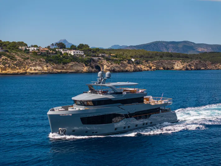 Oscar Yacht Photos Pics Luxurious 2023 Numarine 37XP yacht cruising near scenic coastline.