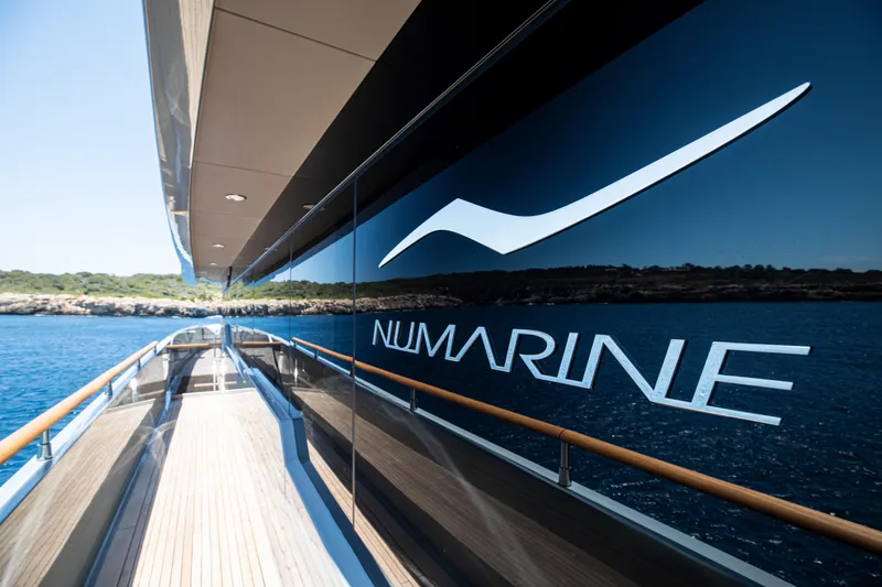 Oscar Yacht Photos Pics 2023 Numarine 37XP yacht reflecting ocean view, sleek design, and luxury branding.