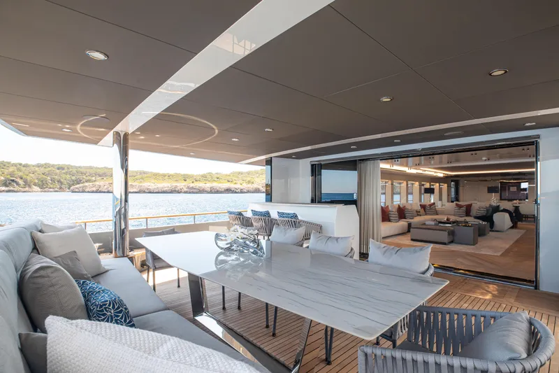 Oscar Yacht Photos Pics Luxurious 2023 Numarine 37XP yacht interior with elegant dining area and scenic ocean view.